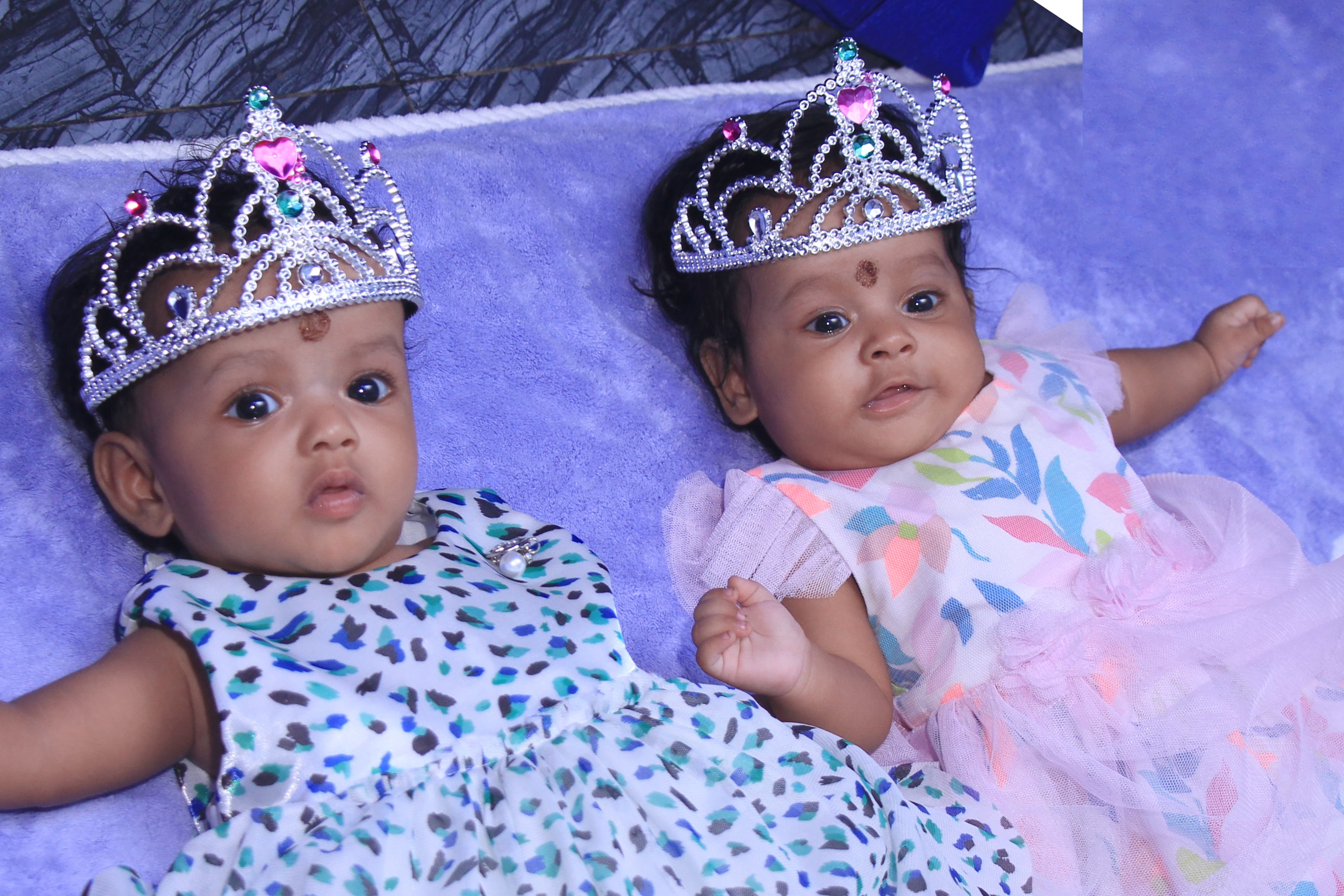 Newborn baby dressed in a soft outfit for the shoot